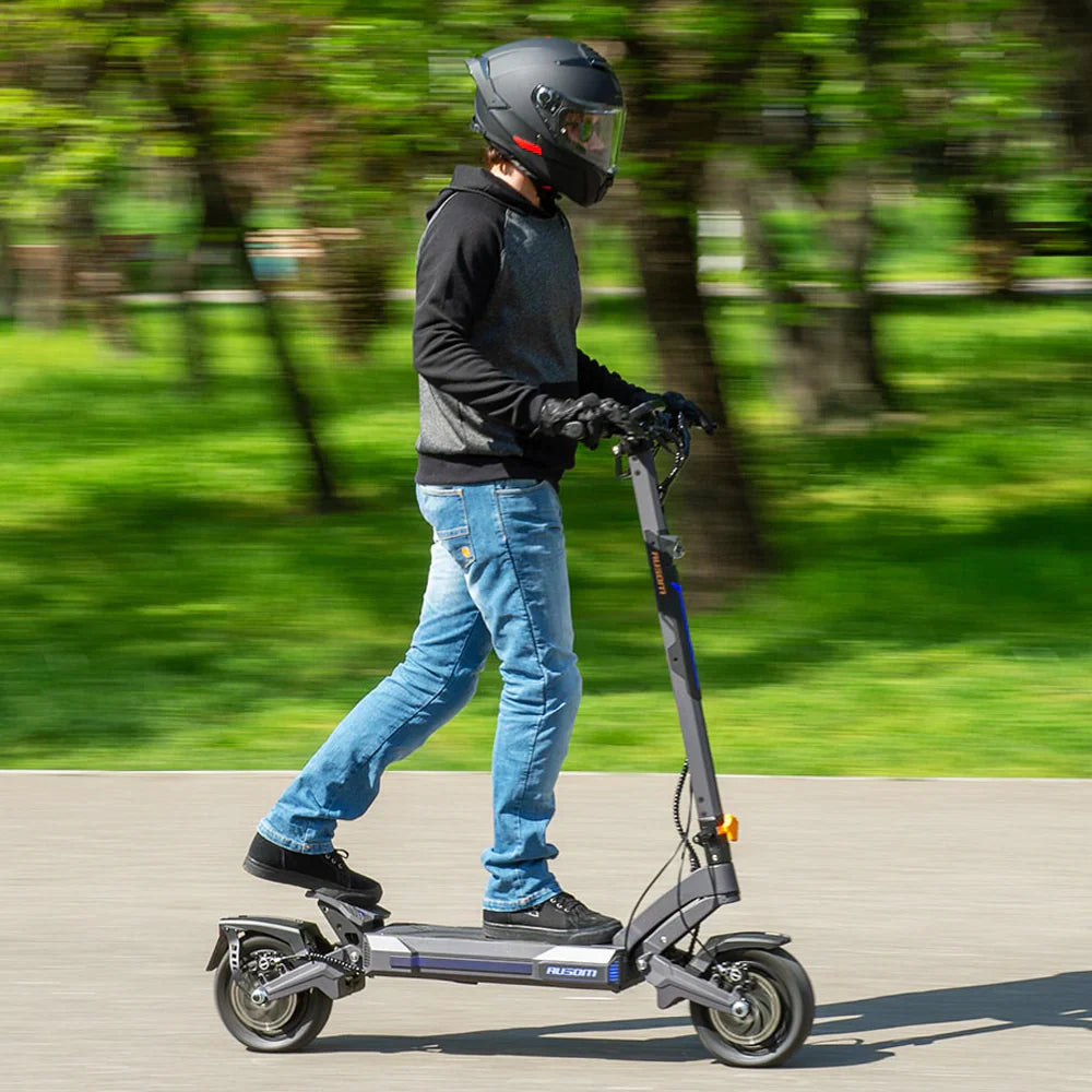 aovo pro electric scooter with human riding scooter helmet on
