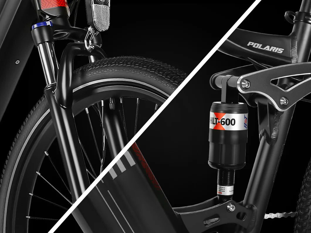 Close-up view of a black mountain bike, showing the front suspension fork and tire on the left, and the rear shock absorber with a “HLT-600” label on the right. The bike frame is labeled “POLARIS.”.