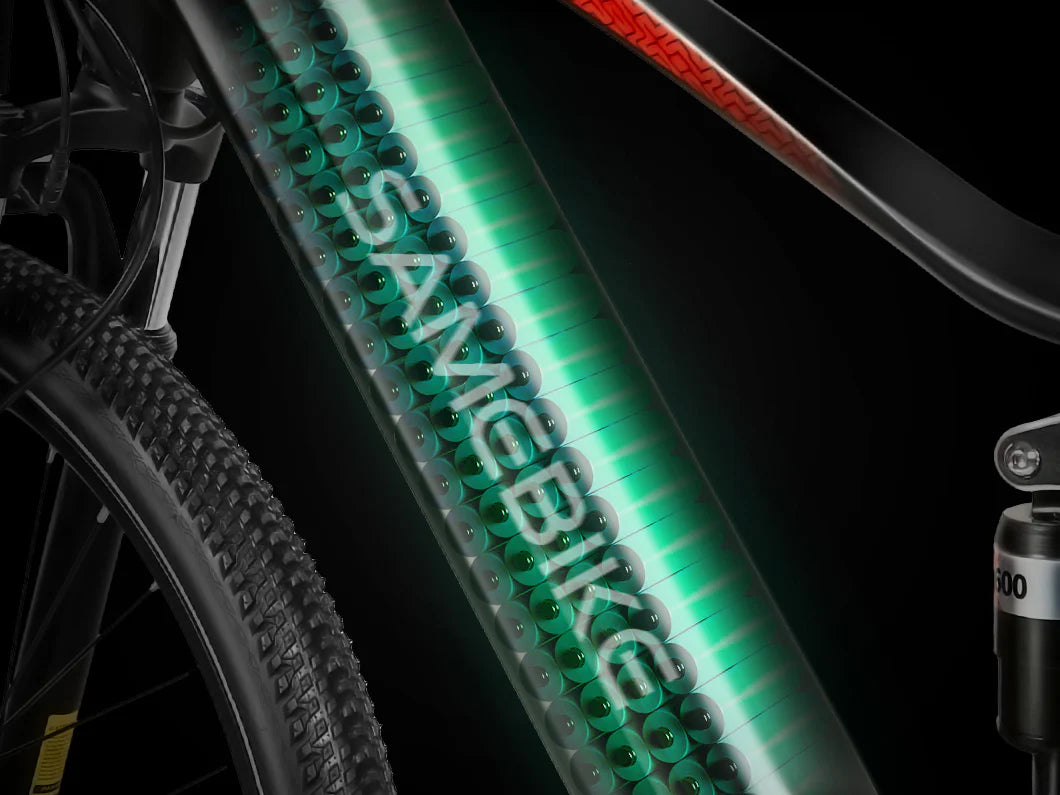 Close-up of an electric bicycle frame showing a transparent section revealing rows of battery cells inside, with the word SAMEBIKE illuminated across the battery pack.