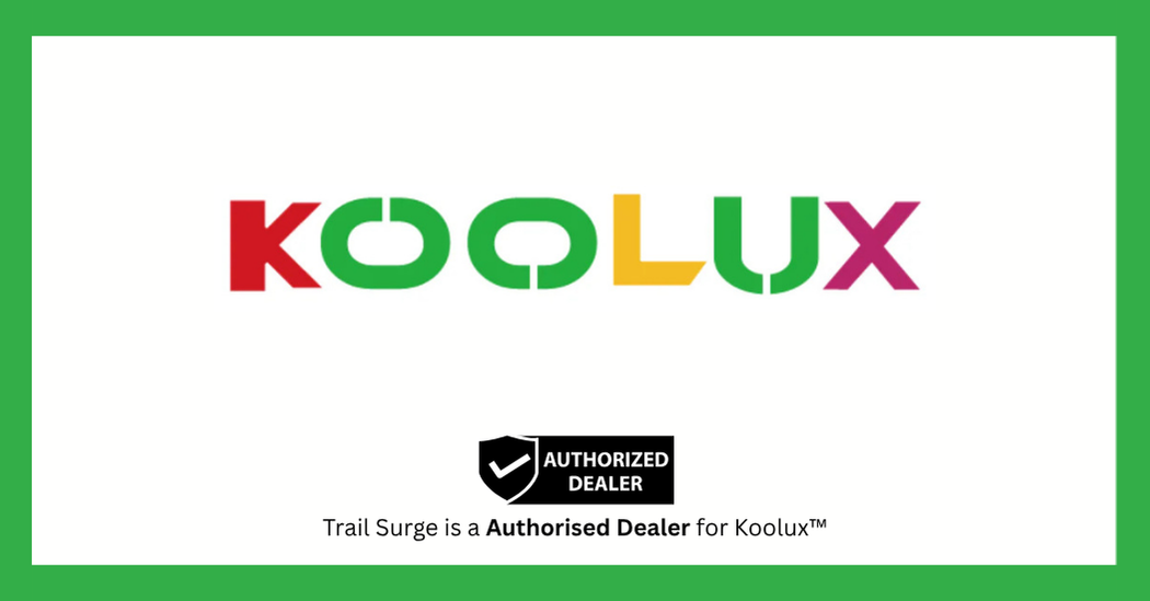 KOOLUX logo in colorful letters on a white background with a green border. Below is a black badge labeled “Authorized Dealer” and text: “Trail Surge is an Authorised Dealer for Koolux™”.