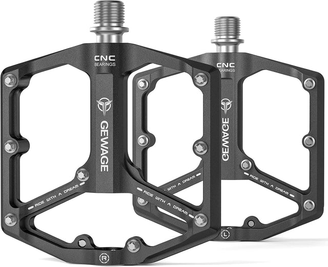A pair of Gewage Bike Pedals Black with a wide, flat platform, visible screws, metallic axles, and "RIDE WITH A DREAM" plus "CNC BEARINGS" text.