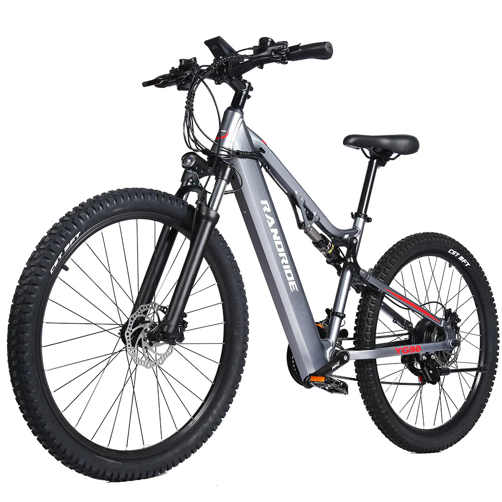 The Randride YX90A Electric Mountain Bike by Randride, shown in silver with a 1000W rear hub motor, rugged fat tires, disc brakes on both wheels, and a durable frame, is displayed against a white background.
