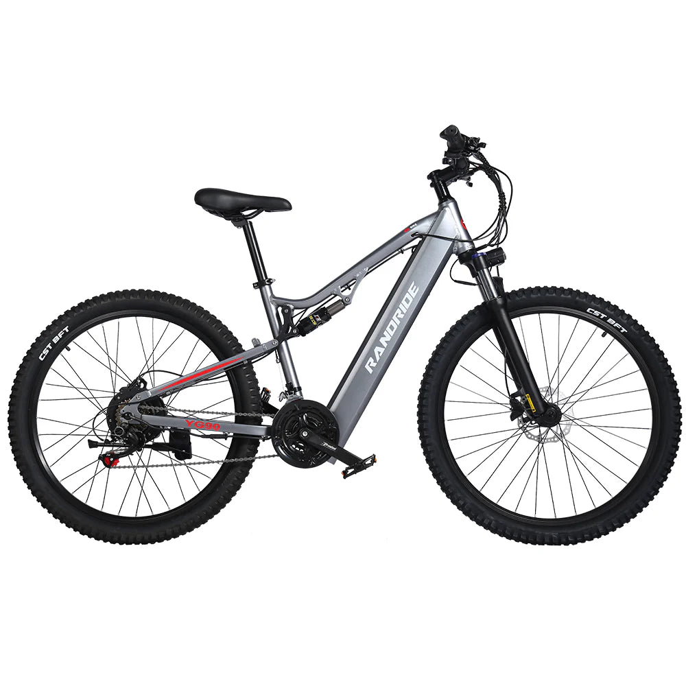 The Randride YX90A Electric Mountain Bike, shown in side view on a white background, features front suspension, thick tires, a 1000W rear hub motor, and the RANDRIDE brand name on its gray frame.
