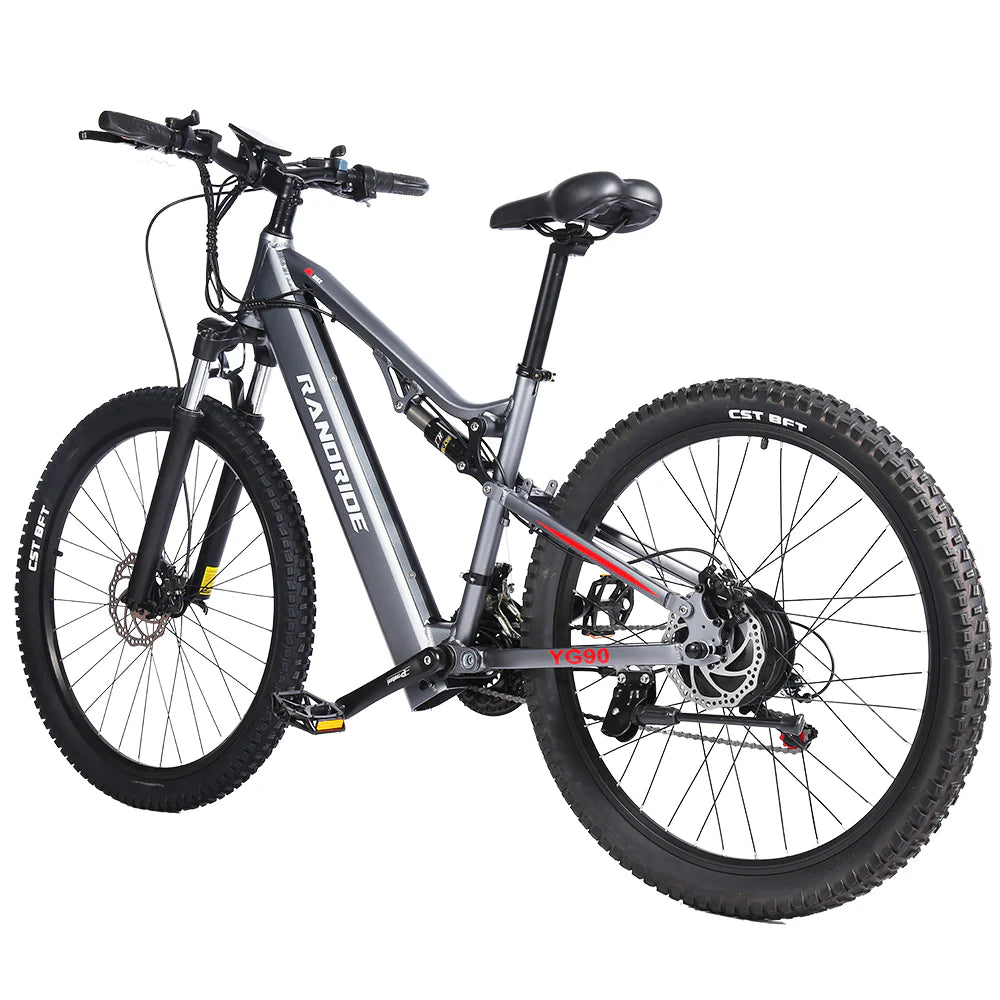 The Randride YX90A Electric Mountain Bike by Randride features a sturdy gray frame, full suspension, disc brakes, thick tread tires, and a comfortable black saddle, displayed on a white background.