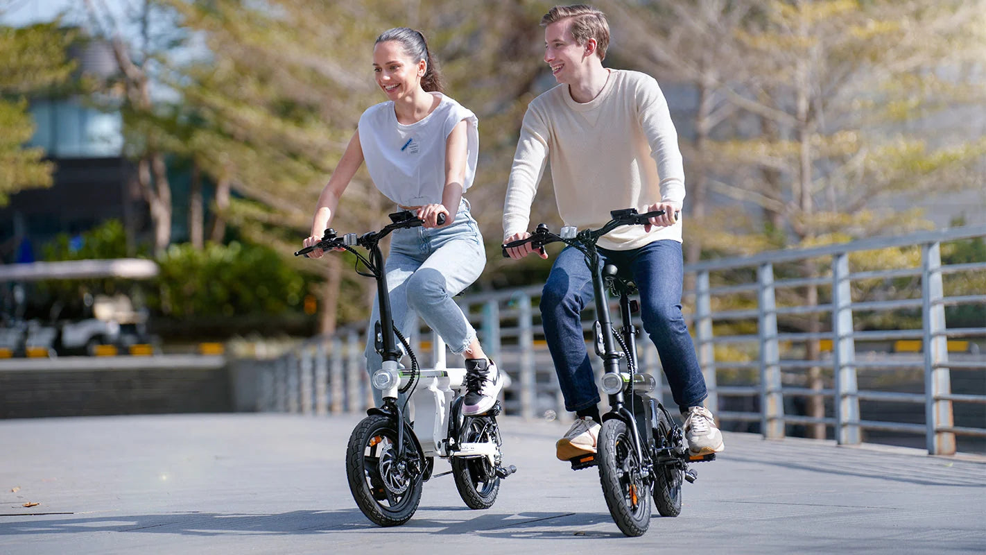 mini electric bikes riding on the road at a slow speed