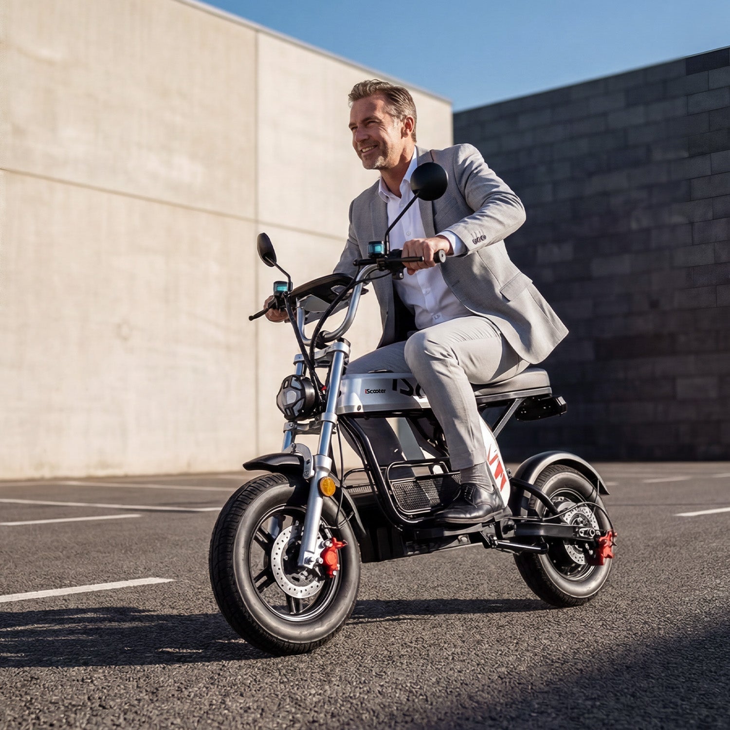 Seated electric scooter with suspension and pneumatic tyres
