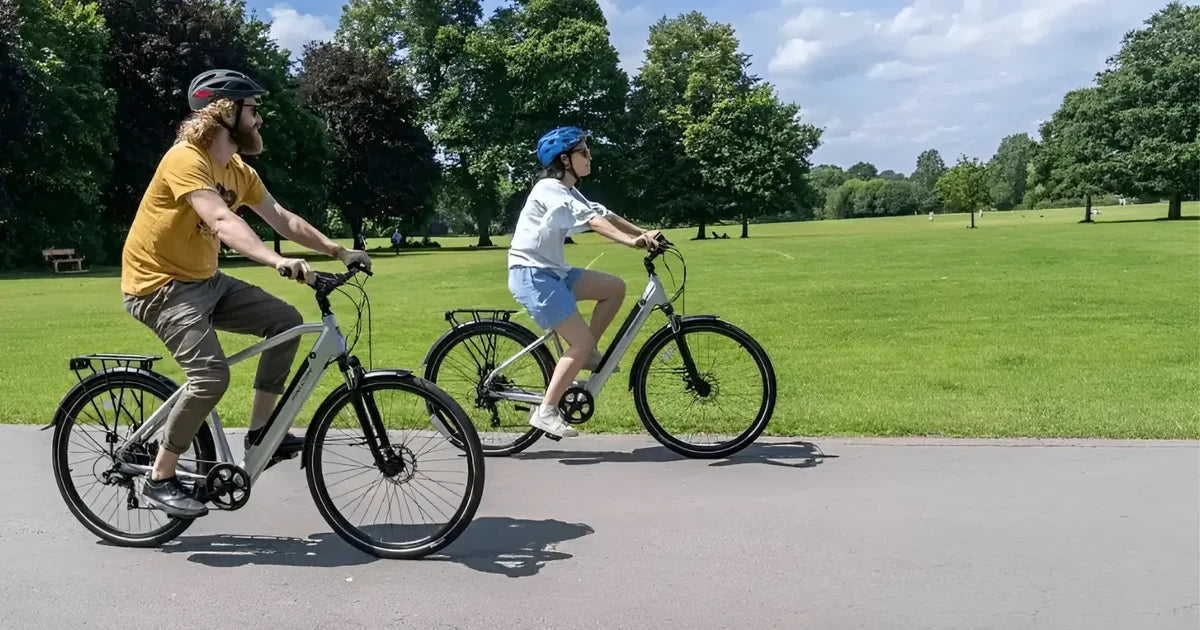 2 people riding road legal electric bikes